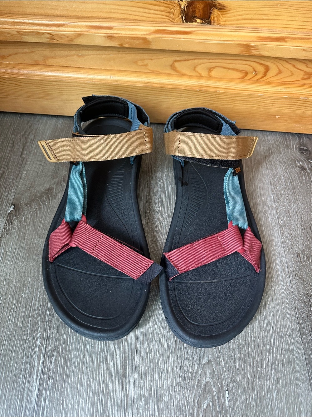 Teva Black Footbed Sandals with Red and Teal Straps and Tan Accents